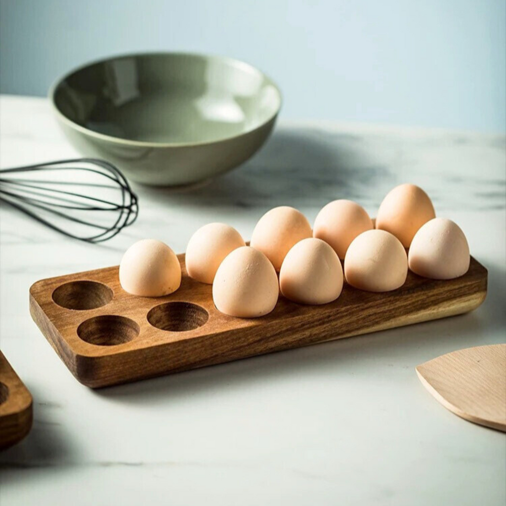 Wooden-egg-trays-with-capacity holes-filled-with-eggs-displayed-on-a-kitchen-counter