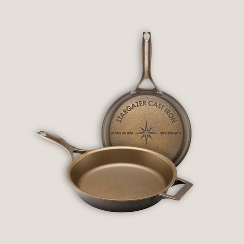 Empty 12‑inch pre‑seasoned cast iron skillet with helper and main handles, shown overhead on white background