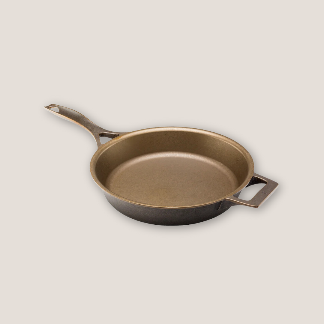 Side view of 12-inch cast iron skillet highlighting curved walls and depth of cooking surface
