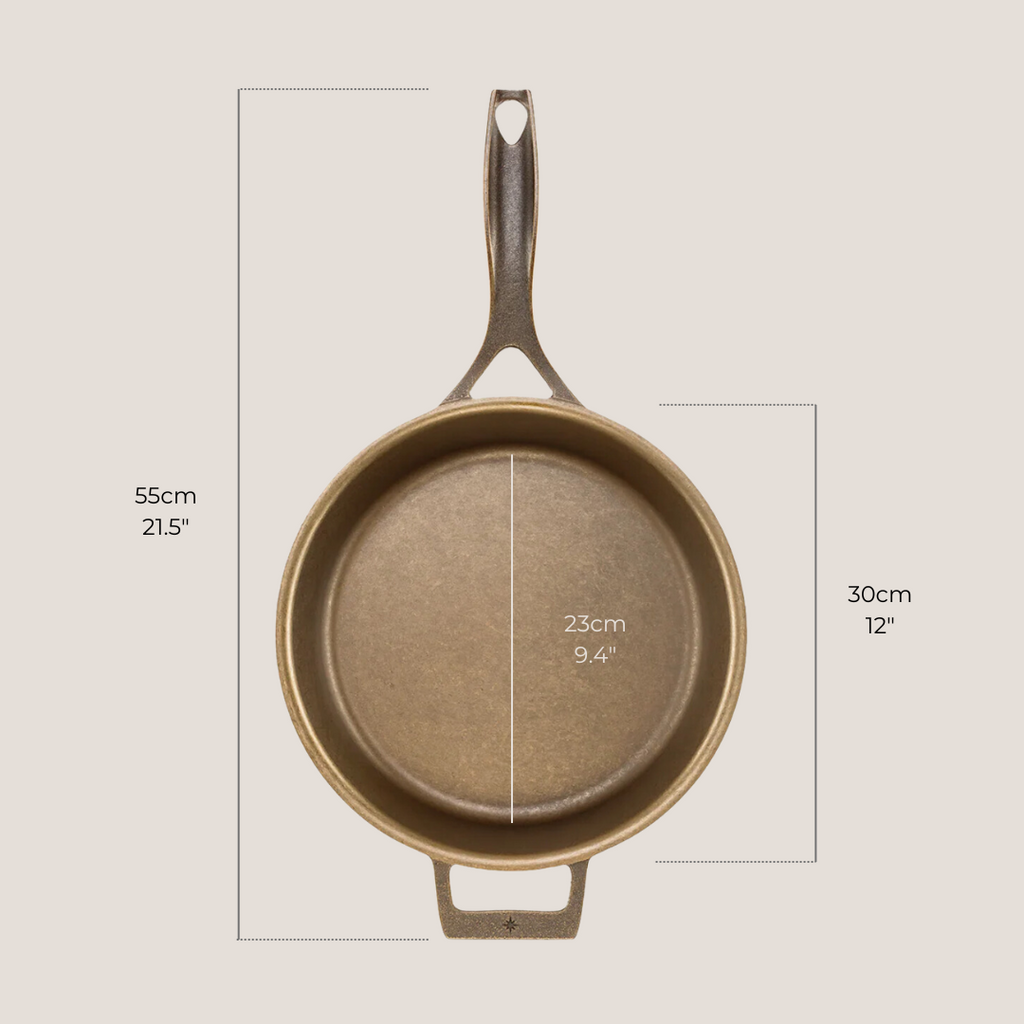 12-inch cast iron skillet placed next to measuring tape showing diameter and depth