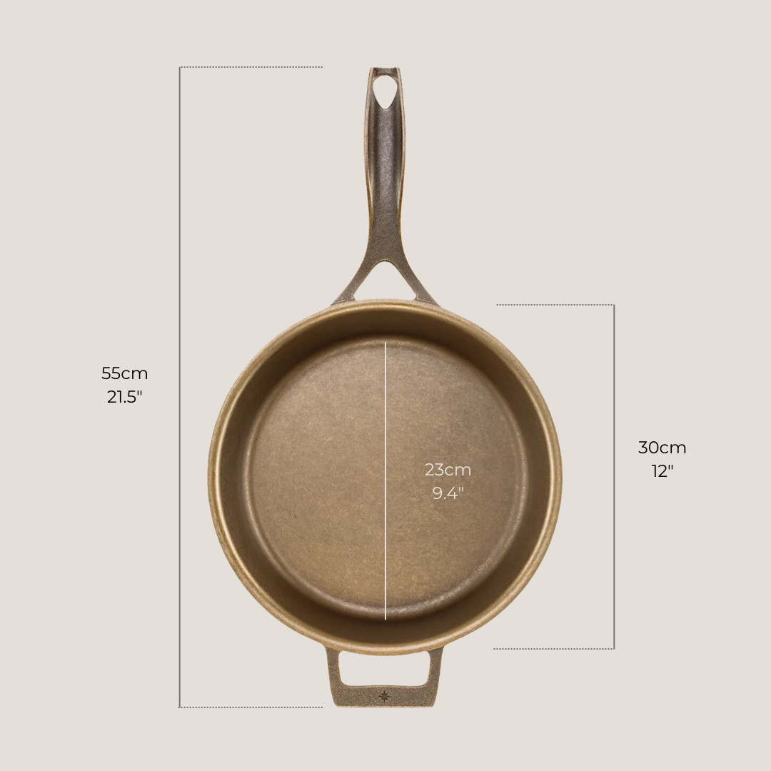 12-inch cast iron skillet placed next to measuring tape showing diameter and depth