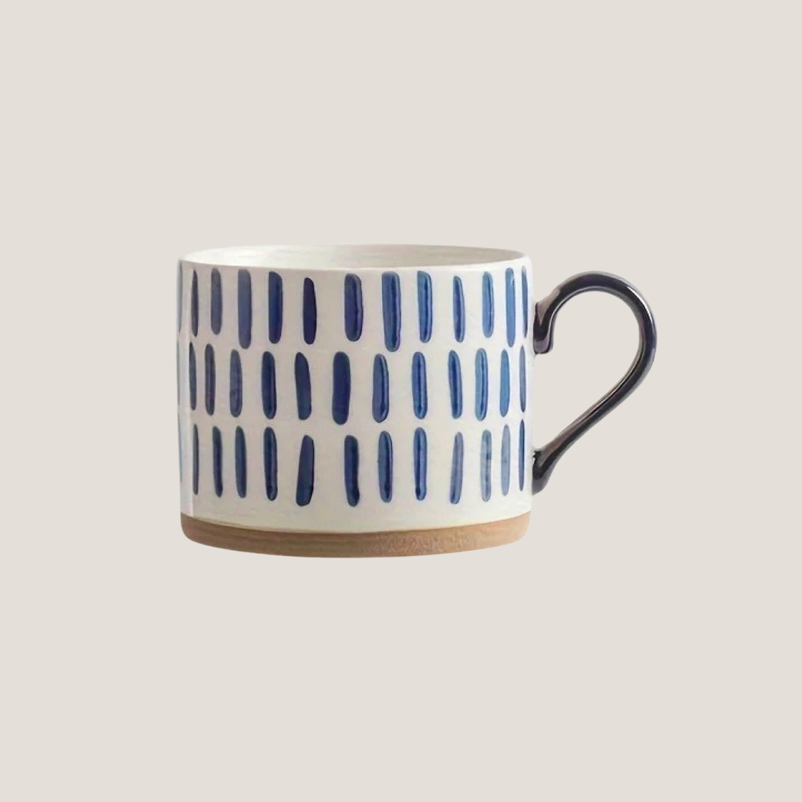Ceramic mug with blue long brush stroke lines forming a minimal abstract pattern