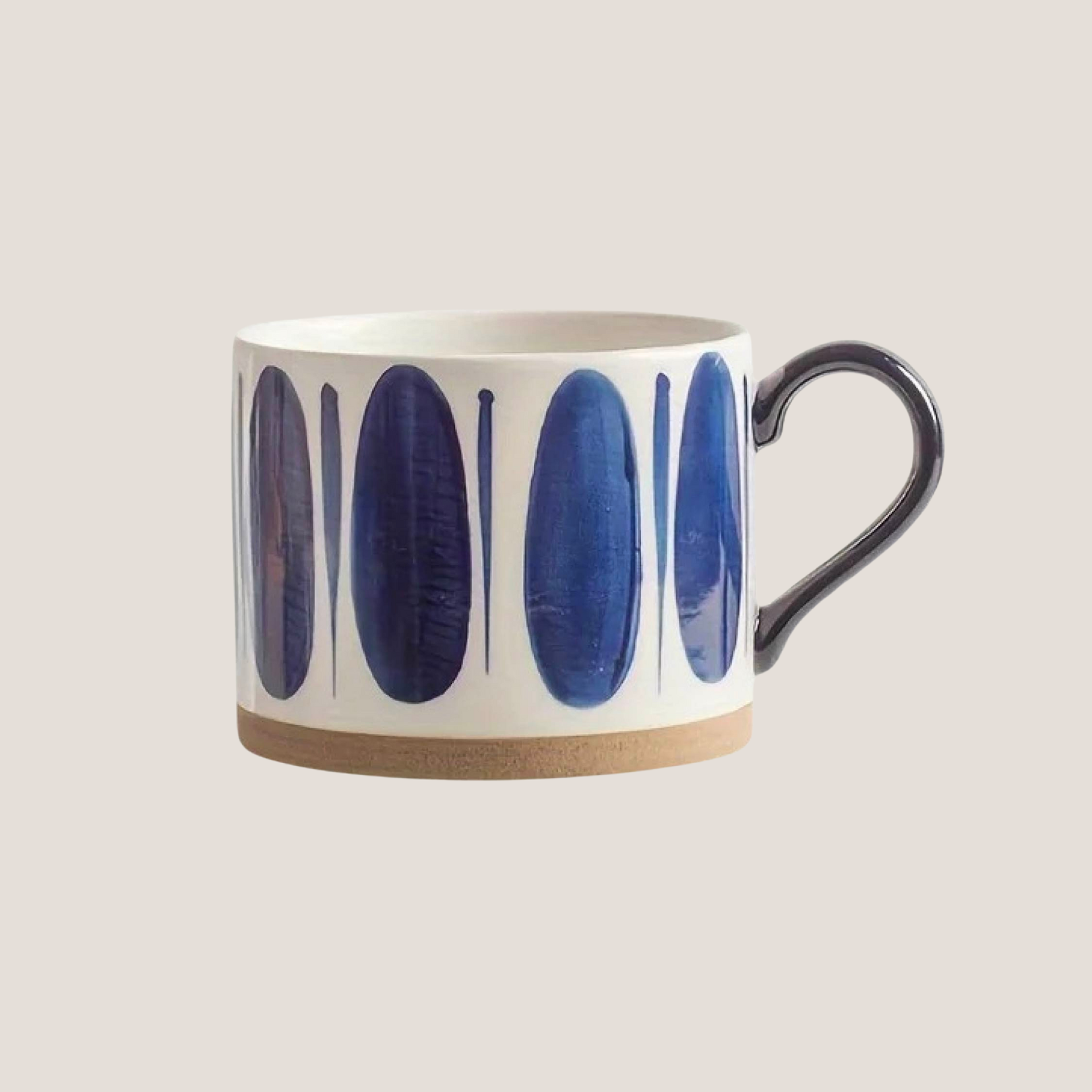 Ceramic mug featuring big, long oval-shaped blue brushstroke design in a hand-painted style