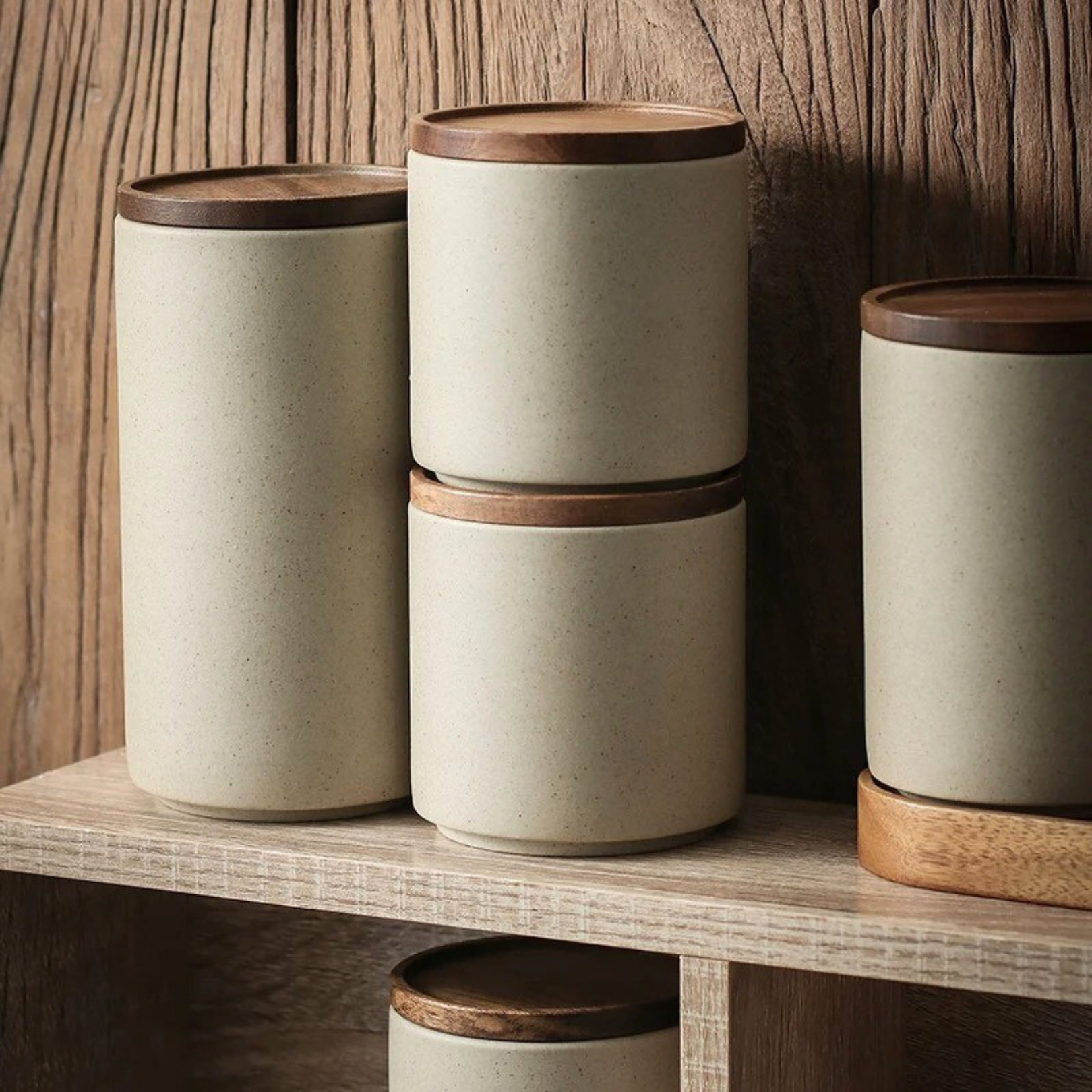 White ceramic jar with wooden lid displayed as kitchen or pantry decor