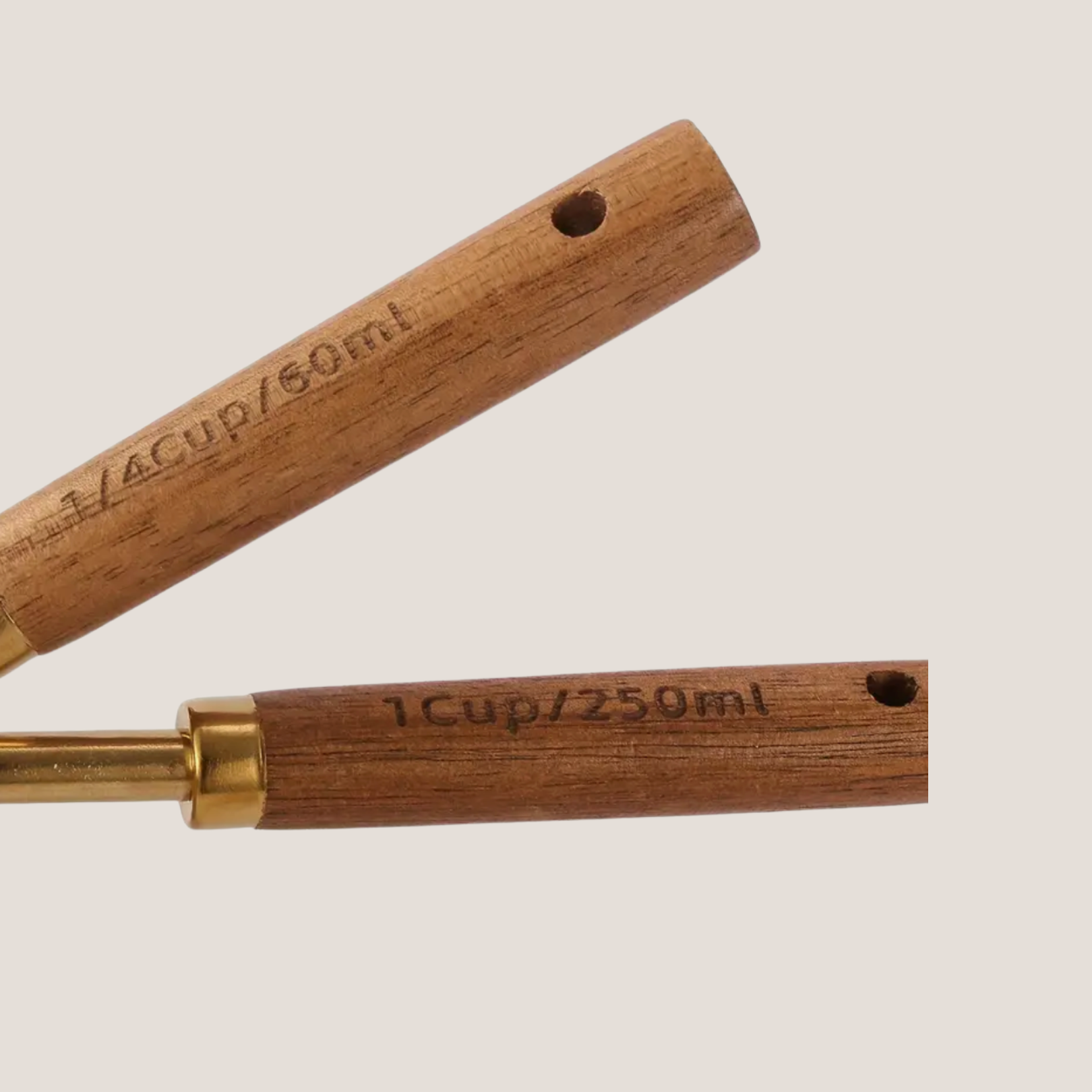 Close-up of a wooden measuring spoon handle showing etched measurement markings clearly