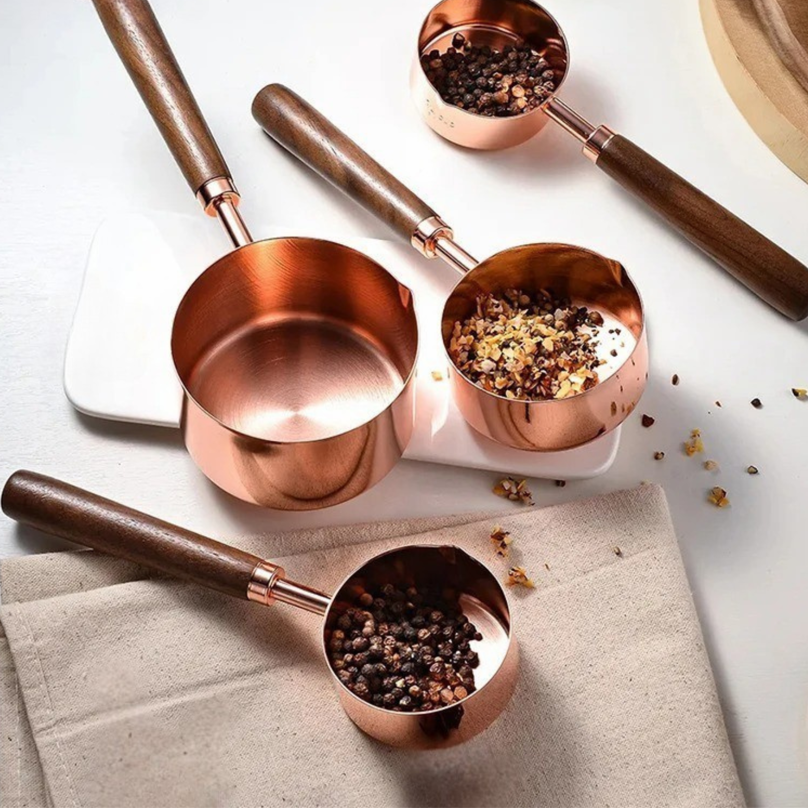 Rose measuring cups arranged together as a styled kitchen accessory set