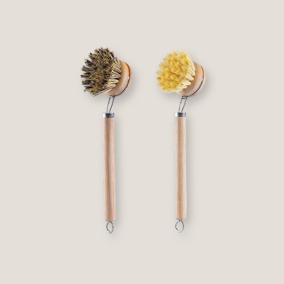 Sisal and coconut dish brush with replaceable head displayed upright  on a plain background