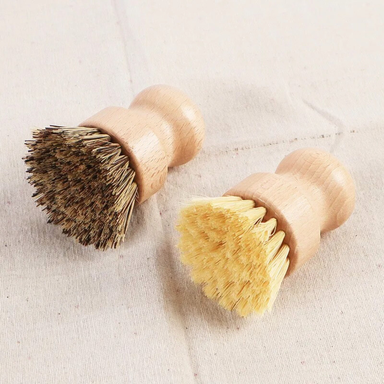 Close-up of sisal and coconut fiber brush heads showing texture and fiber contrast in a different angle