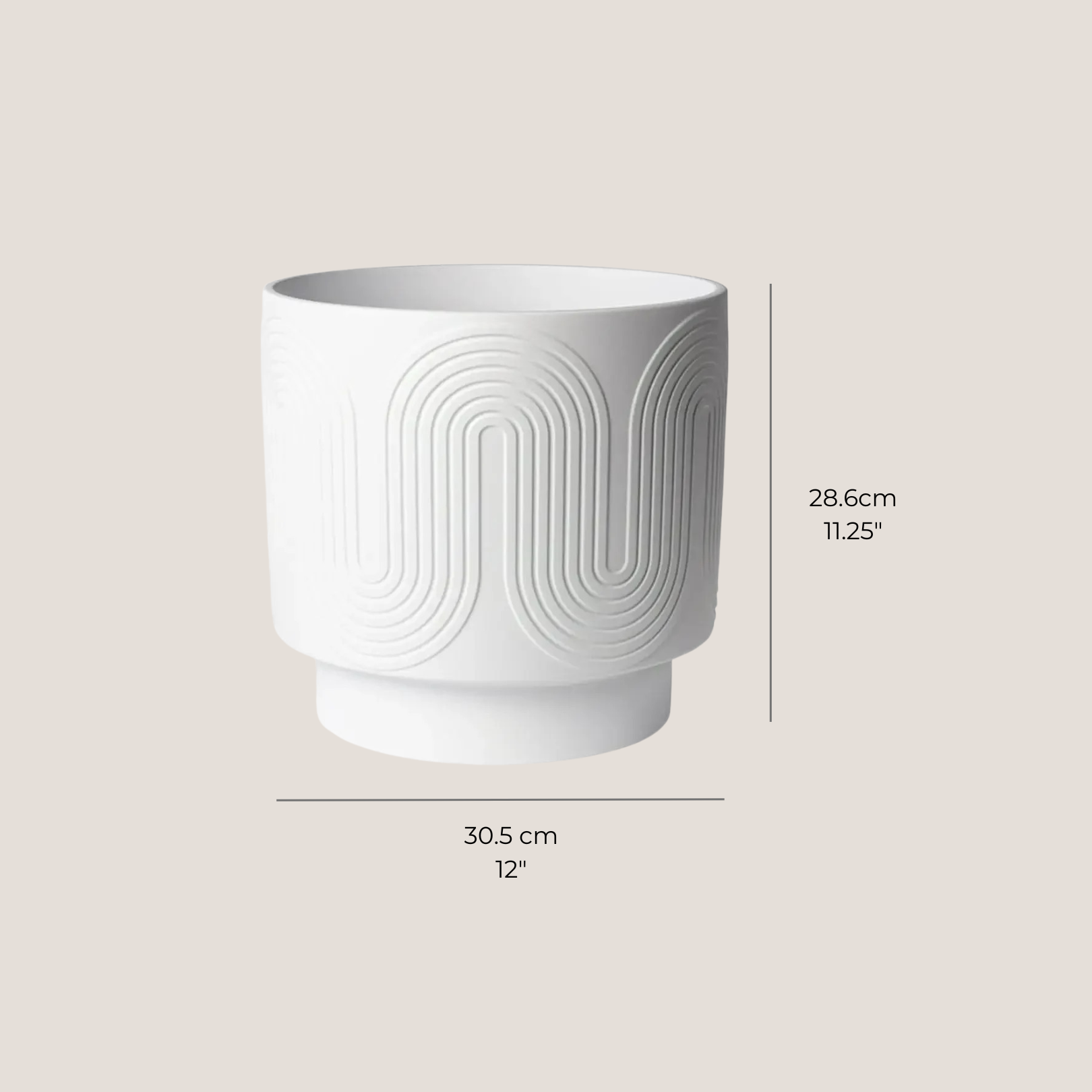 White ceramic planter next to ruler showing dimensions