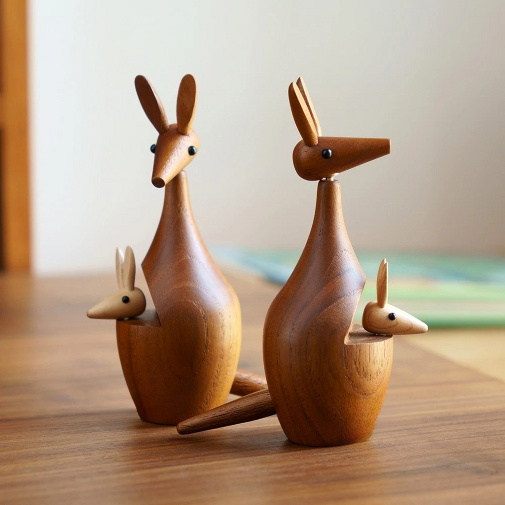 Two handcrafted wooden kangaroo decor pieces displayed side by side